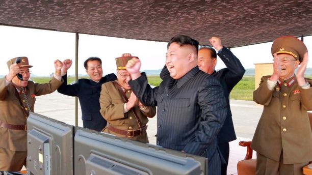 In this undated photo distributed on Saturday, Sept. 16, 2017, by the North Korean government, North Korean leader Kim Jong Un, center, celebrates what was said to be the test launch of an intermediate range Hwasong-12 missile at an undisclosed location in North Korea. Independent journalists were not given access to cover the event depicted in this image distributed by the North Korean government. The content of this image is as provided and cannot be independently verified. (Korean Central News Agency/Korea News Service via AP)