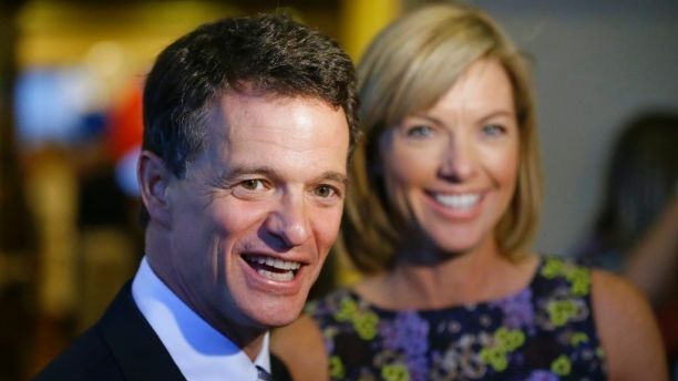 In this Aug. 5, 2014 file photo, Republican David Trott, a candidate for Michigan's 11th congressional district, stands next to his wife, Kappy, during an interview at his election night party in Troy, Mich. In a statement Monday, Sept. 11, 2017, Rep. Dave Trott, R-Mich., says he will not seek re-election. (AP Photo/Carlos Osorio)