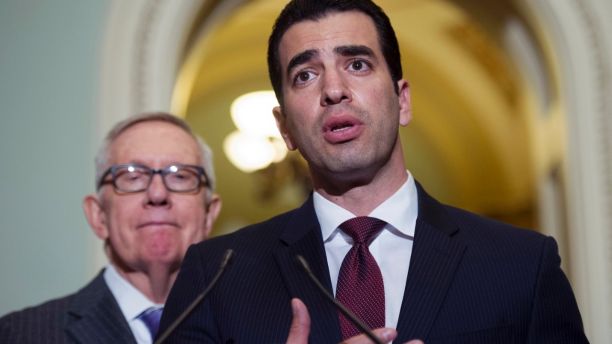 FILE - This Nov. 14, 2016 file photo Rep.-elect Ruben Kihuen, D-Nev.,right, speaks with reporters as Sen. Harry Reid, D-Nev., left, listens on Capitol Hill in Washington. The chairman of the House Democrats' campaign committee called on Kihuen to step down after a report Friday, Dec. 1, 2017, that he allegedly sexually harassed his campaign's finance director. (AP Photo/Cliff Owen,File)
