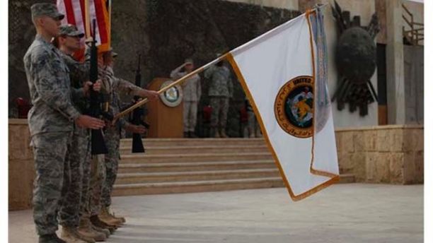 The US Forces Iraq colors are lowered before being encased in a ceremony in Baghdad, Iraq, Thursday, Dec., 15, 2011. The ceremonies mark the official end of the US military mission in Iraq. (AP Photo/Pablo Martinez Monsivais, Pool)