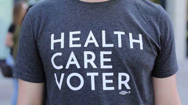 A protester wears a t-shirt as SoCal Health Care Coalition protests at UC San Diego in La Jolla, California, U.S., October 12, 2017. REUTERS/Mike Blake - RC18361BA750