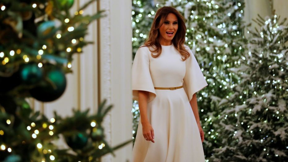U.S. First Lady Melania Trump greets school children as she tours the holiday decorations with reporters at the White House in Washington, U.S. November 27, 2017.  REUTERS/Jonathan Ernst - RC1A66CC6040