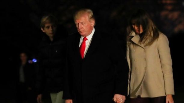 President Donald Trump together with first lady Melania Trump and their son Barron Trump returns to the White House in Washington, Monday, Jan. 1, 2018, from a holiday break at his Mar-a-Lago estate in Palm Beach, Fla. (AP Photo/Manuel Balce Ceneta)