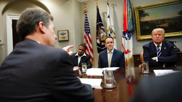 From left, Kansas Gov. Sam Brownback gestures as he speaks as Darrell Scott Senior Pastor of the New Spirit Revival Center, Kentucky Gov. Matt Bevin, and President Donald Trump participate in a prison reform roundtable in the Roosevelt Room of the Washington, Thursday, Jan. 11, 2018. (AP Photo/Carolyn Kaster)
