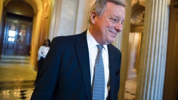 Sen. Dick Durbin, D-Ill., the Senate Democratic whip, smiles as he heads for a weekly policy luncheon on Capitol Hill in Washington, Tuesday, Dec. 12, 2017. (AP Photo/J. Scott Applewhite)
