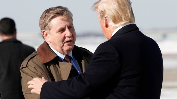 U.S. President Donald Trump greets special election Republican candidate Rick Saccone upon Trump's arrival in Pittsburgh, Pennsylvania, January 18, 2018. REUTERS/Kevin Lamarque - RC18B4A2F240